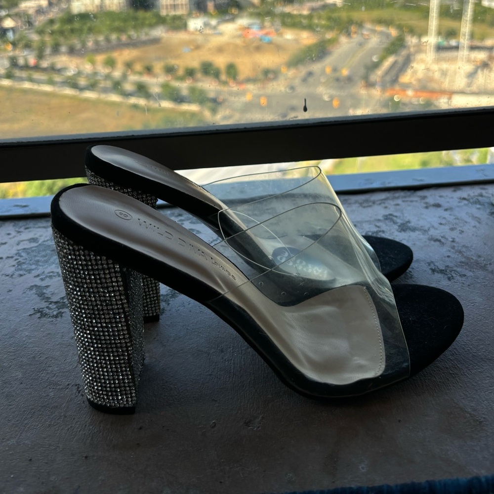 Black heels with sparkly block heel and clear strap. Size 8.